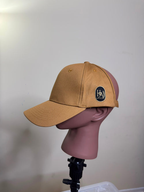 House of Adjeh satin-lined backless baseball cap in camel